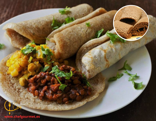 Injera etíope con wat suave, guiso de lentejas y verduras, receta saludable y tradicional.