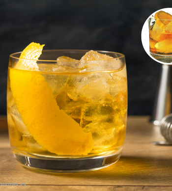 Cóctel Rusty Nail en vaso corto con hielo, mezcla de whisky escocés y Drambuie, decorado con piel de limón